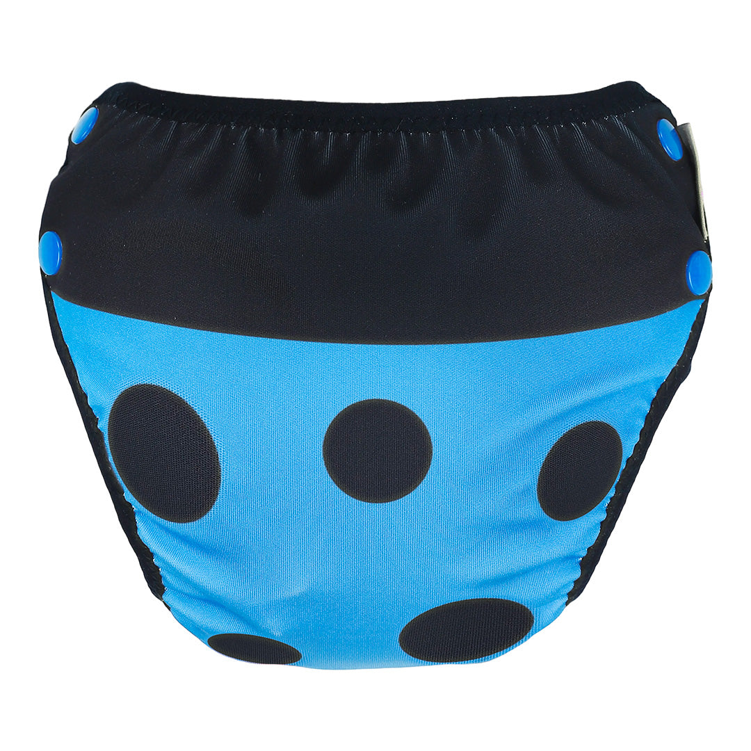 Blue swim bottoms with black polka dots on a white background